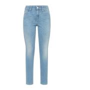 Smal pasform jeans med blegnet denim og sand overflade