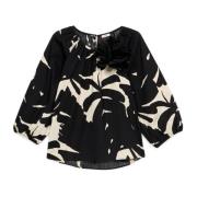 Blomstret bomuldsbluse med broche