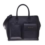 Handbag in black leather with crocodile print